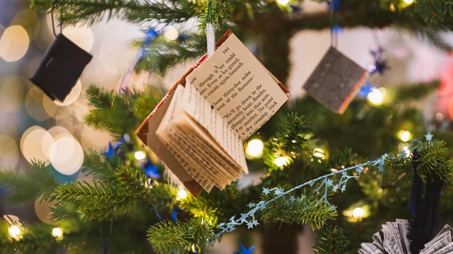 Christmas tree decorations including lights and tiny books