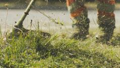 mowing overgrown grass