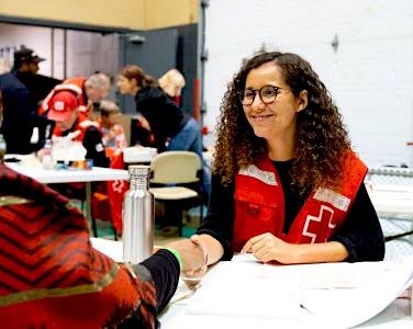 Red Cross worker providing case support to a community member.