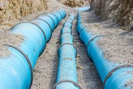Blue water pipes in ground